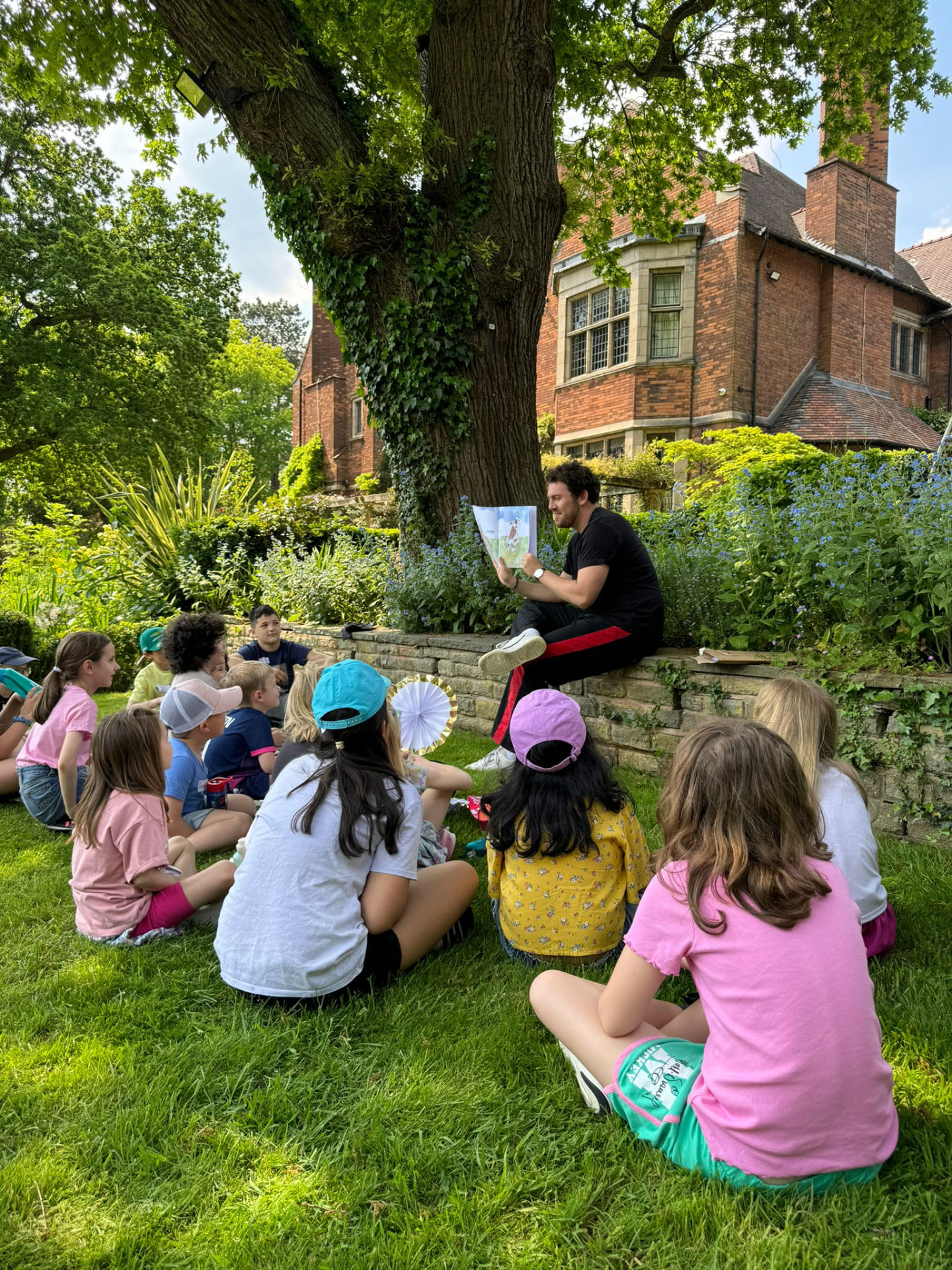 Young children sitting and listening attentively during a Bamboo Studios session