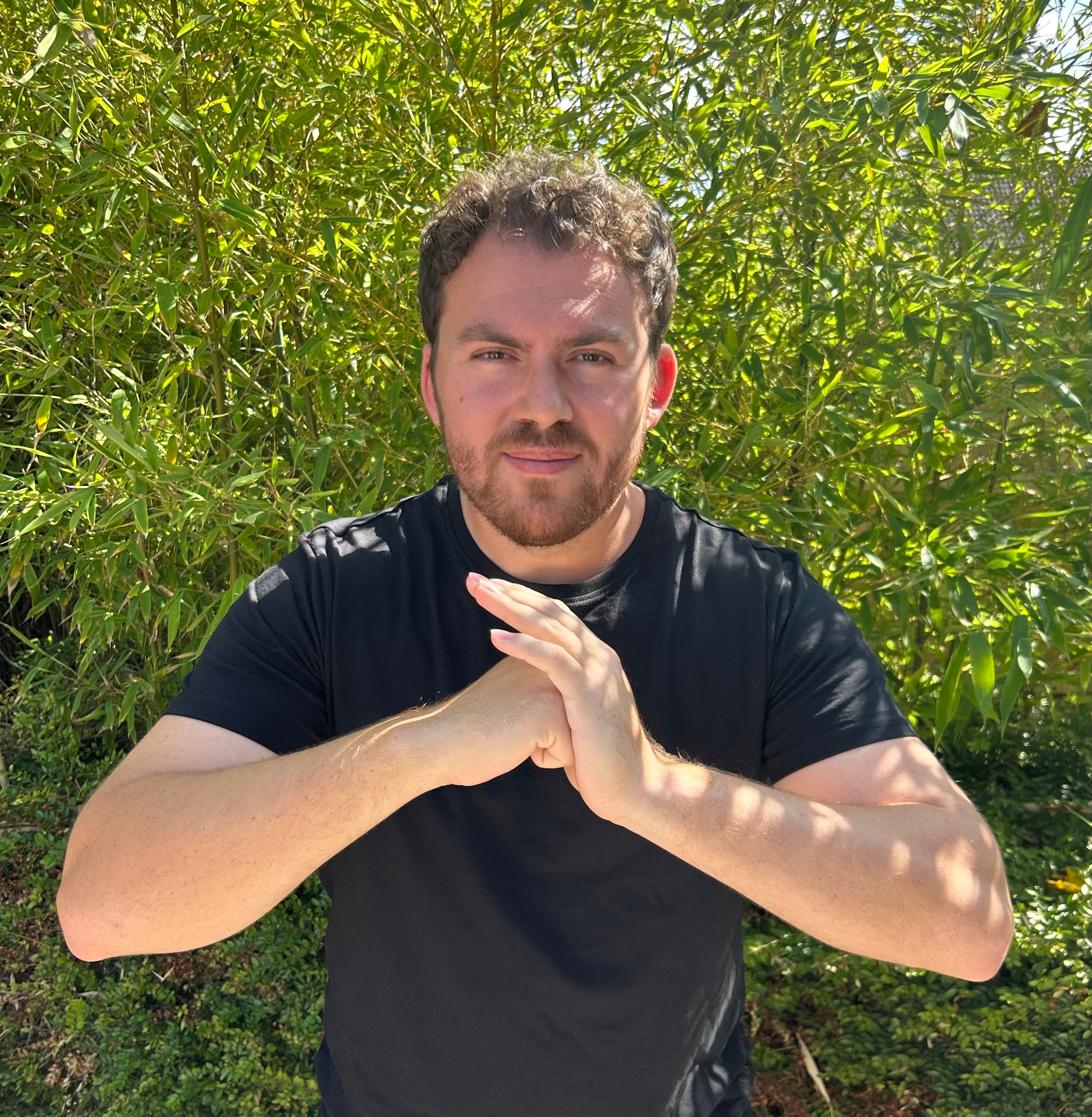 Archie Dunnett, founder of Bamboo Studios and 3rd Degree Black Belt, performing a Kung Fu salute